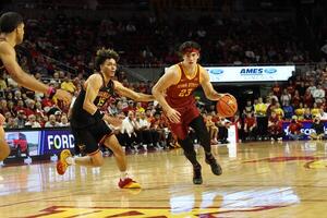 Iowa State Cyclones forward Blake Buchanan (23) beats Grambling State Tigers forward Antonio Munoz (15) off the dribble during the first half at James H. Hilton Coliseum. editorial_image