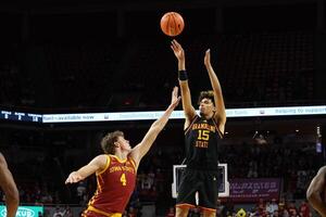 Grambling State Tigers forward Antonio Munoz (15) shoots over Iowa State Cyclones forward Eric Mulder (4) during the second half at James H. Hilton Coliseum. editorial_image