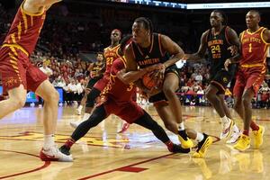 Grambling State Tigers guard Jamil Muttilib (11) is tied up by Iowa State Cyclones guard Tamin Lipsey (3) during the second half at James H. Hilton Coliseum. editorial_image