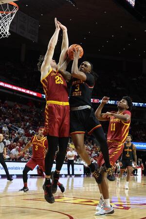 Iowa State Cyclones forward Blake Buchanan (23) defends Grambling State Tigers forward Rickey Ballard (3) during the second half at James H. Hilton Coliseum. editorial_image