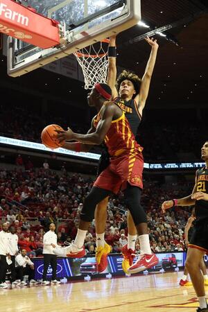 Grambling State Tigers forward Antonio Munoz (15) defends the shot from Iowa State Cyclones guard Dominick Nelson (11) during the first half at James H. Hilton Coliseum. editorial_image