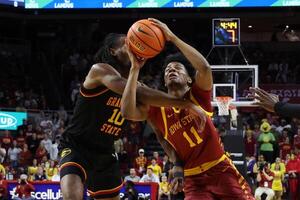 Iowa State Cyclones guard Dominick Nelson (11) is founded by Grambling State Tigers forward Richard Amaefule (10) during the first half at James H. Hilton Coliseum. editorial_image
