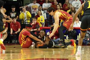Grambling State Tigers guard Derrius Ward (0) and Iowa State Cyclones guard Tamin Lipsey (3) battle for a lose ball during the first half at James H. Hilton Coliseum. editorial_image