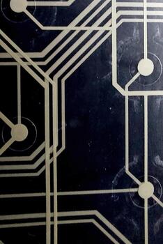 Printed Circuit Board With Wiring Tracks on Dark Background Showcasing Intricate Electronic Design photo