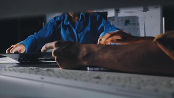 A person working on a computer with a keyboard video
