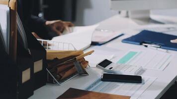 A person is working on a computer at a desk video