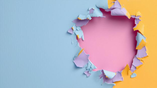 Vibrant, colorful paper with a circular hole, showcasing a playful, creative design. photo