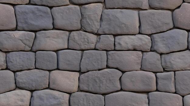 A close-up view of a meticulously crafted stone wall, showcasing a pattern of irregular, fitted stones in muted grays and browns. photo