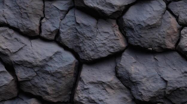 de cerca ver de un texturizado Roca muro, exhibiendo un multitud de irregular, oscuro gris rocas con visible grietas y grietas foto