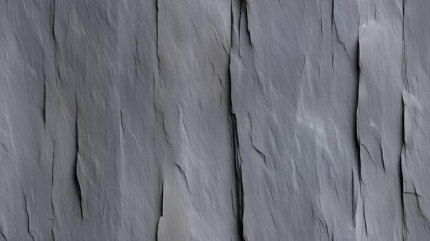 A detailed close-up view showcases a textured surface of slate, exhibiting deep grooves and ridges. photo