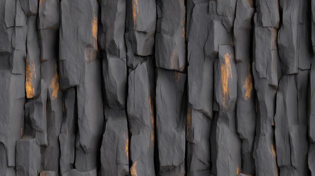 A detailed close-up view of a dark gray stone wall, showcasing vertical rectangular sections with subtle orange highlights. photo