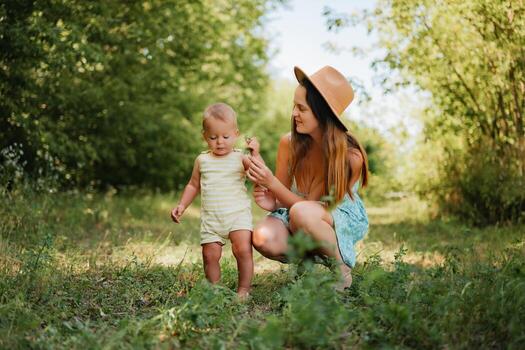 Mother and child in a green field photo