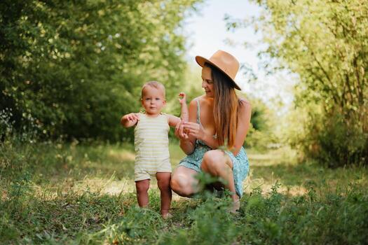 Mother and child in green natural setting photo