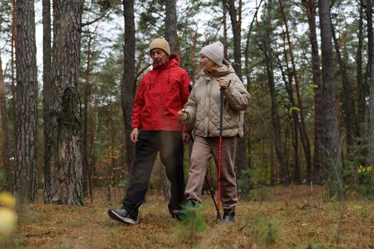 Couple walking in the forest photo