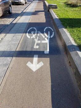 Bike Cycle Path Signs Showing Direction for Cyclists in a Vibrant Urban Setting on a Sunny Day photo