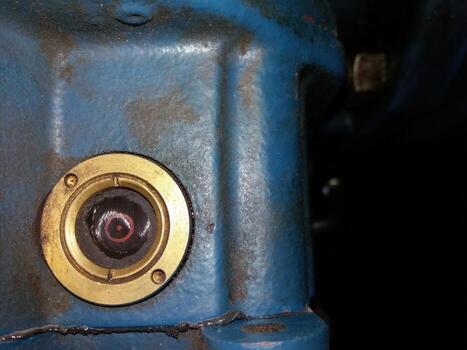 Compression Head Housing Detail Reveals Intricate Structural Elements and Material Condition photo