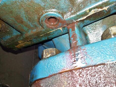 Compression Head Housing Viewed From Below Reveals Wear and Potential Leakage Issues photo