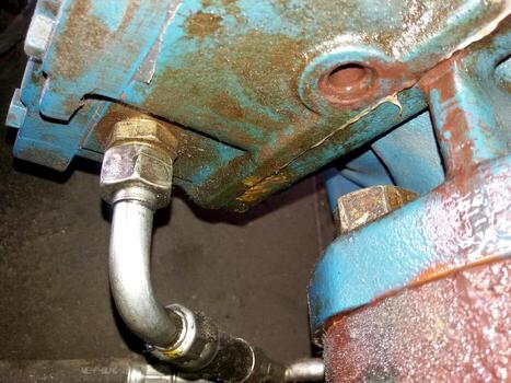 Compression Head Housing Component Revealing Rust and Wear in Industrial Machinery Setting photo