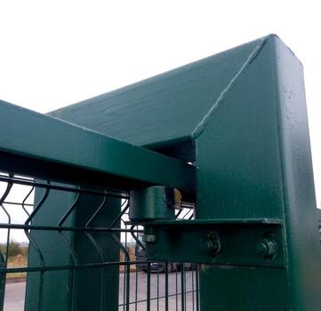 Detail of a Robust Rolling Gate Mechanism Showcasing Durability and Design at a Storage Facility photo
