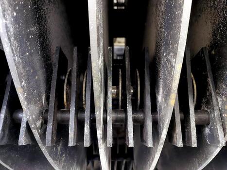 Industrial Grain Crusher Hammers Close-Up Showing Heavy-Duty Design and Functional Details photo