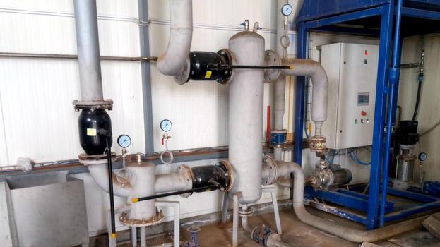 Hydraulic Arrow Component of a Heating System in an Industrial Setting photo