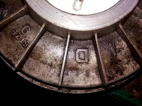 Hydraulic Drive Clutch With Detailed Markings and Wear Patterns Captured in a Workshop Environment photo