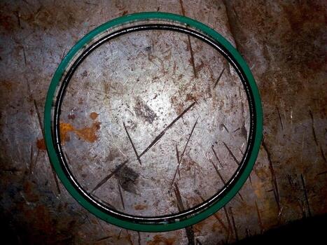 Hydraulic Seal Shown on a Metallic Surface in an Industrial Workshop Setting photo