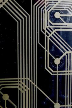 Printed Circuit Board Design Featuring Intricate Wiring Tracks on a Black Background photo
