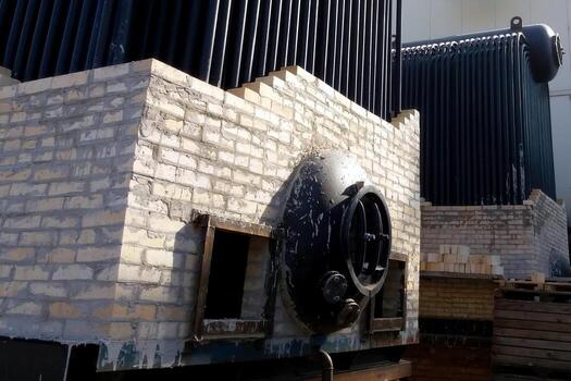 Installation Process of Large Steam Boiler Components at Industrial Site in Broad Daylight photo