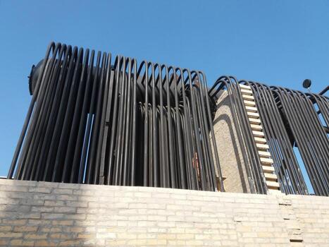 Steam Boiler Installation Showcasing Complex Piping and Design in Industrial Setting photo