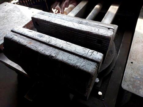 Locksmith Vice on Workbench During Crafting Session in a Workshop photo