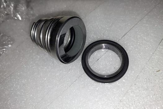 Mechanical pump seal components displayed on a clean surface ready for installation and inspection photo