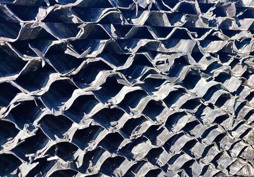 Offset corrugated fills designed for efficient cooling tower performance in industrial settings photo
