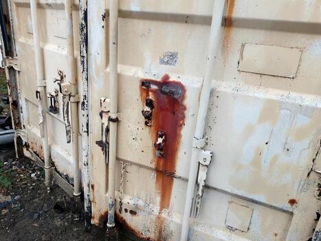 Old Container Door Reveals Stories of Time and Rust in an Abandoned Location photo