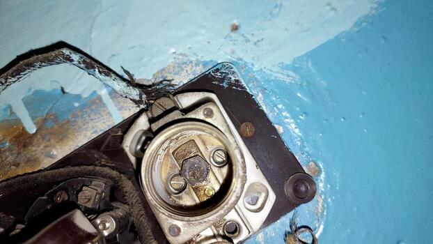 Old Electrical Fuses Showcasing Wear and Age in a Vintage Setting With Chipped Paint and Rust photo