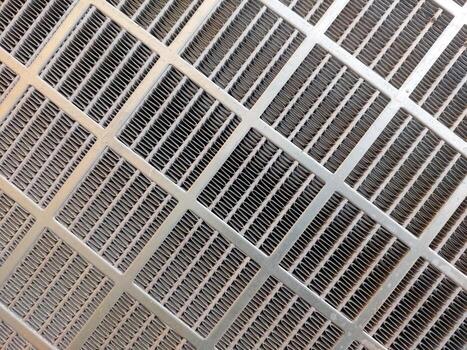 Intricate Patterns of Stainless Steel Mesh Captured From Above in Natural Light photo