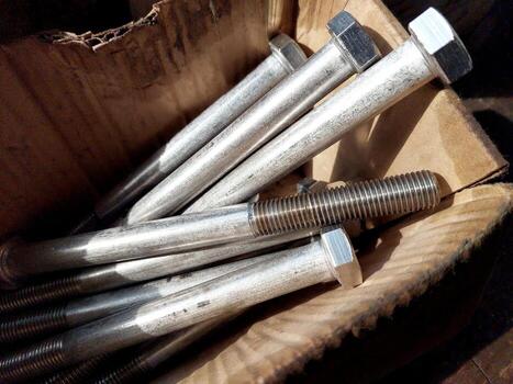 Box Containing Steel Bolts Ready for Use in Construction and Engineering Projects photo