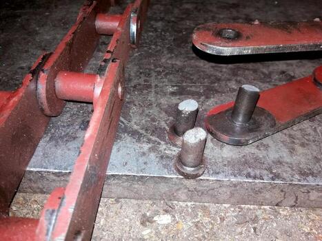 Close-up of Traction Plate Chain Parts Showing Detailed Connection Mechanisms and Surface Textures photo