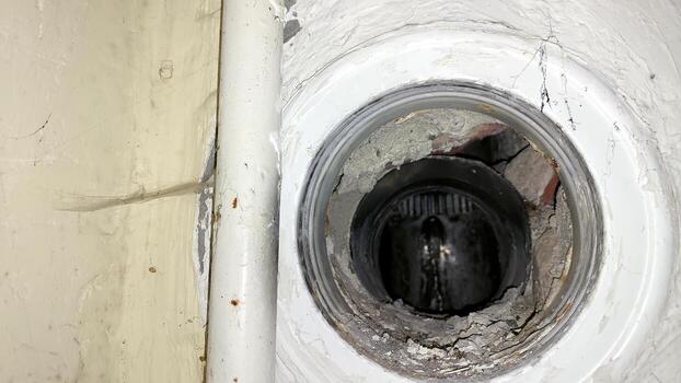 Ventilation hole revealing inner structure of wall in residential building photo