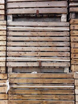 A close up of a stack of wooden pallets photo