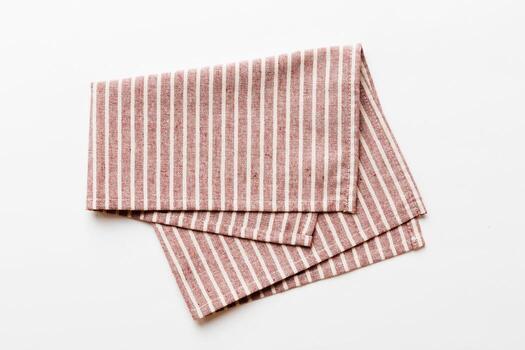 top view with red empty kitchen napkin isolated on table background. Folded cloth for mockup with copy space,Minimal style photo