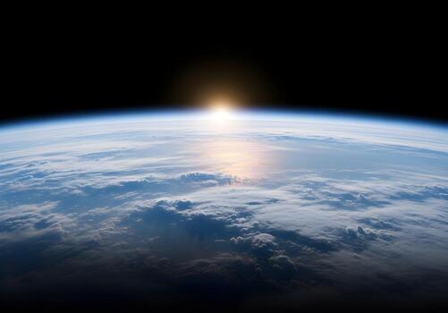 Mesmerizing orbital perspective of Earth's curved horizon, revealing the planet's vibrant atmosphere and vast clouds illuminated by a glorious sunrise from the cosmic dark photo