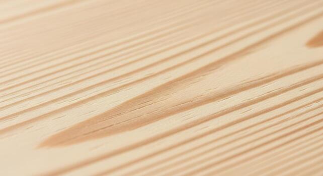Close up view of natural light colored pine wood grain texture with subtle variations in tone and pattern photo