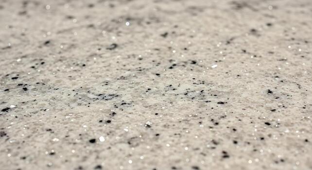 Close up of sparkling white and black glitter particles creating a textured abstract background effect photo