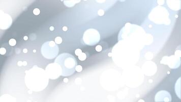 Bokeh grey circles create soft, blurred white spheres in a gentle dance on a light background. Perfect for abstract designs. video