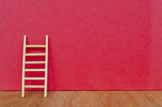 Ladder with red background with customizable space for text. photo