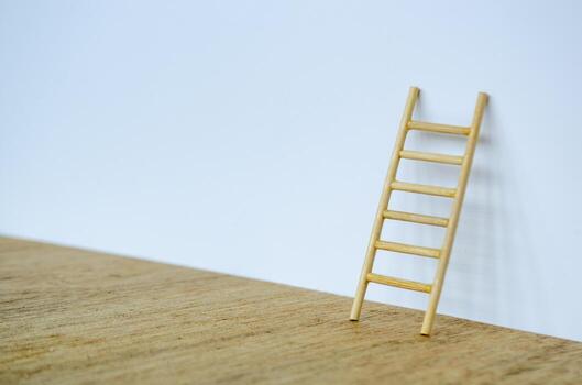 Side view of small ladder on white cover background with customizable space for text. photo