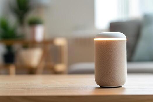A smart speaker emits a gentle glow while resting on a wooden table. The bright and inviting living room features blurred furniture and plants in the background, creating a relaxed atmosphere photo