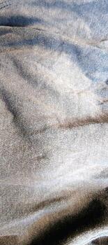 A simple yet elegant close-up of a light blue fabric texture. The image captures the fine weave and a slightly fuzzy surface, creating a sense of comfort photo