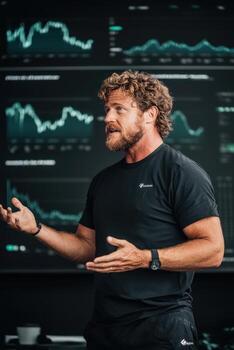 Man explains cryptocurrency market. Graphs display trading data. Analytics on screen. Presentation of financial investments. photo